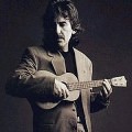 George Harrison and one of his three ukeleles.