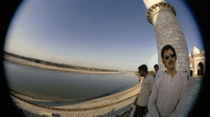 Harrison in India 1966 on boat