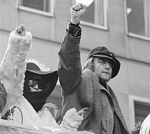 John and Yoko raising their fists