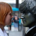 Woman and Lennon statue