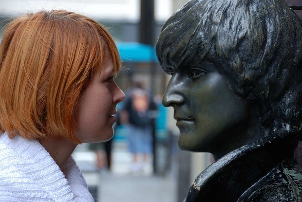 Woman and Lennon statue